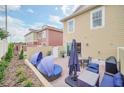Private outdoor patio with stylish lounge seating and dining area for relaxation at 7587 Sunflower Cir, Kissimmee, FL 34747