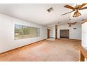 Spacious living room with large windows, plush carpet, and ample natural light at 770 Manor Dr, Bartow, FL 33830