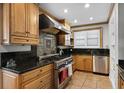 Well-equipped kitchen with stainless steel appliances and granite countertops at 910 Alameda St, Orlando, FL 32804