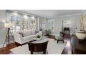 Cozy living room featuring plantation shutters, neutral paint, and ample seating at 910 Alameda St, Orlando, FL 32804