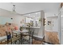 Dining area showcasing hardwood floors and seamless flow into the kitchen at 2652 Laser Ct, Orlando, FL 32826