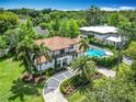 Aerial view of the home showcasing pool, landscaping, and architectural style at 2614 Parkland Dr, Winter Park, FL 32789