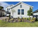 Charming single-Gathering home features a beautifully landscaped front yard at 2926 Crest Wave Dr, Clermont, FL 34711