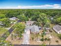 Spacious home with a large yard and mature trees, providing ample privacy and a serene setting at 1104 E University Ave, Deland, FL 32724