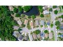 A neighborhood view featuring the home in a wooded surrounding, and highlighting the lot boundaries at 13624 Springtide Ct, Orlando, FL 32826
