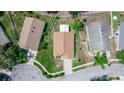 A high-angle view showcases the roof, landscaping, and surrounding neighborhood at 13624 Springtide Ct, Orlando, FL 32826