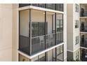 Screened in balcony with black railings and a seating area at 14501 Grove Resort Ave # 1441, Winter Garden, FL 34787