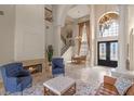 Bright living room boasting high ceilings, a fireplace, comfortable seating, and a dining area for easy entertaining at 2771 Willingam Dr, Davenport, FL 33837