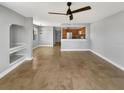 Open living area featuring tile flooring, a ceiling fan, and an open layout at 13839 Fairway Island Dr # 1128, Orlando, FL 32837