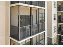 View of a screened-in balcony offering a cozy outdoor space at 14501 Grove Resort Ave # 3335, Winter Garden, FL 34787
