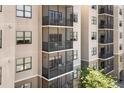 Condo building exterior featuring multiple balconies, offering residents outdoor living at 14501 Grove Resort Ave # 3335, Winter Garden, FL 34787