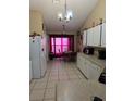 Bright kitchen with white cabinets and a breakfast nook at 1639 Nestlewood Trl, Orlando, FL 32837