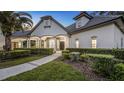 Elegant home with stately pillars, arched entryways, and professionally landscaped grounds at 1906 Oakbrook Dr, Longwood, FL 32779