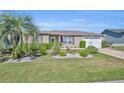 Well-maintained single-story home with lush landscaping and a welcoming curb appeal at 2192 Kerwood Loop, The Villages, FL 32162