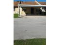 Charming townhouse with a covered carport and well-maintained front yard at 2218 Abbey Rd, Winter Haven, FL 33880