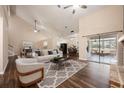 Open-concept living area with wood floors, vaulted ceilings, and sliding glass doors to a screened patio at 2611 Albion Ave, Orlando, FL 32833