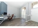 Bright office featuring hard wood flooring, a modern desk, and a front view window at 3200 Town And Country Rd, Oviedo, FL 32766