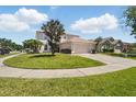 Well-manicured lawn and landscaping surround this charming home on a corner lot at 343 Grand Royal Cir, Winter Garden, FL 34787