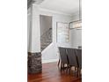 Staircase with hardwood floors, metal railings and stone accents at 3535 Lake Sarah Dr, Orlando, FL 32804