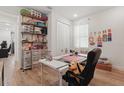 Well lit bedroom, great for an office or craft room, with custom shelving and wood-look floors at 4779 Cragmere Loop, Clermont, FL 34711