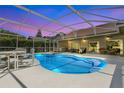 Screened in pool with lounge chairs for sunny relaxation at 5836 Goldenwood Dr, Orlando, FL 32817