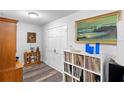 Bright hallway with wood-look floors, features a coat closet, and stylish décor at 617 E Citrus St, Altamonte Springs, FL 32701