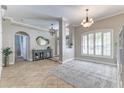 Open foyer with tile flooring and view into the living spaces at 8037 Bangle Ln, Orlando, FL 32836