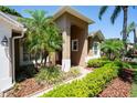Charming front entrance with lush landscaping and a walkway leading to the door at 8037 Bangle Ln, Orlando, FL 32836