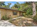 Classic brick house with well-kept yard featuring mature landscaping at 180 Broadmoor Rd, Lake Mary, FL 32746