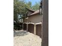Side view of the home's three-car garage with paver driveway at 708 Palenci Ct, Winter Springs, FL 32708