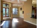 Spacious living area with wood floors, plenty of light, and neutral walls at 708 Palenci Ct, Winter Springs, FL 32708