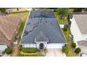 Aerial shot of the home, highlighting its backyard, roof solar panels and proximity to neighboring houses at 826 Jade Forest Ave, Orlando, FL 32828