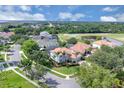 Stunning aerial view of the home nestled within a lush neighborhood with golf course views at 1786 Lee Janzen Dr, Kissimmee, FL 34744