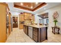 Beautiful kitchen featuring custom cabinetry, an oversized island, stainless steel appliances and a light-filled breakfast nook at 32510 Wolf Branch Ln, Sorrento, FL 32776