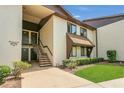 Charming condo building showcasing its well-kept grounds and inviting entryway at 516 Bahia Cir # B, Ocala, FL 34472