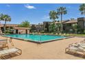A refreshing community pool surrounded by lounge chairs, perfect for relaxation and socializing at 516 Bahia Cir # B, Ocala, FL 34472