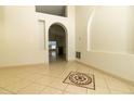 Open-concept living area with tile flooring, neutral walls, and an eye-catching mosaic accent at 11547 Grazeley Ct, Orlando, FL 32837