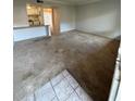 Spacious living room with carpeted floors, an open floorplan and access to kitchen at 131 Water Front Way # 110, Altamonte Springs, FL 32701