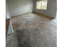 Bright and spacious living room featuring neutral carpet, view from the window, and ample natural light at 131 Water Front Way # 110, Altamonte Springs, FL 32701