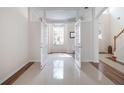 Open office space featuring double french doors, neutral paint, ceramic tile flooring, and natural light at 13156 Hatherton Cir, Orlando, FL 32832