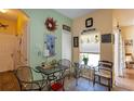 Cozy breakfast nook with a decorative wall, window, and comfortable seating area at 14262 Tanja King Blvd, Orlando, FL 32828