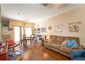 Spacious living room featuring hardwood floors, a comfortable sofa, and bright, airy atmosphere at 14262 Tanja King Blvd, Orlando, FL 32828