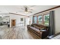 Cozy living room with wood floors, plenty of light, and an adjacent sitting room at 18906 Merrich Rd, Orlando, FL 32820