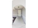 Inviting entryway with an arched porch, leading to a secure-looking white front door at 2404 Timbercreek E Loop, Lakeland, FL 33805