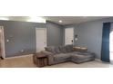 Spacious living area with neutral paint, tile flooring, and comfortable sectional sofa at 2404 Timbercreek E Loop, Lakeland, FL 33805