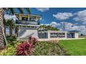 Inviting entrance to Windsor Island Resort featuring lush landscaping and a welcoming sign at 3806 Lana Ave, Davenport, FL 33897