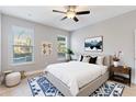 Stylish bedroom showcasing neutral walls, plush carpet, and ample natural light at 5270 Wildwood Way, Davenport, FL 33837