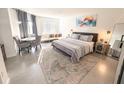 Bright bedroom features a well-decorated interior and comfortable seating near a large window at 6165 Carrier Dr # 2308, Orlando, FL 32819