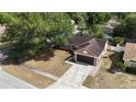 Spacious single Gathering home with a well-manicured yard, located in a friendly neighborhood at 7700 Greytwig Ln, Orlando, FL 32818