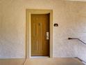Entryway door with gold-painted door and adjacent unit number, 4408 at 8000 Tuscany Way # 4408, Davenport, FL 33896